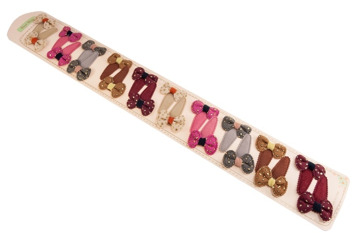 Materiałowe spinki z kokardkami