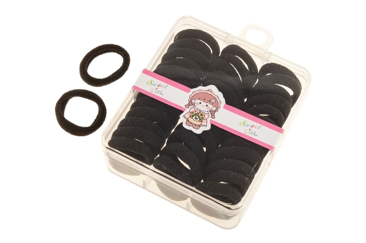 Czarne gumeczki w pudełku